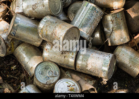 canned package old cluster pile midden Stock Photo