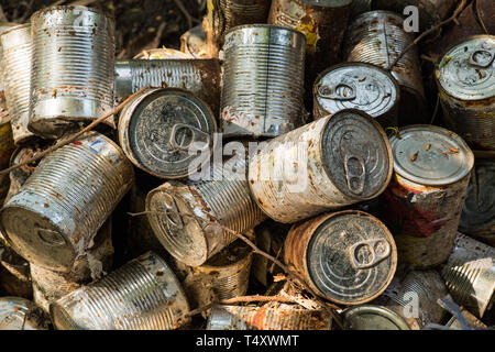 canned package old cluster pile midden Stock Photo