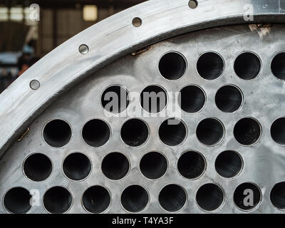 Detail of industrial heat exchanger, a shell and tube condenser, made from stainless steel. Stock Photo