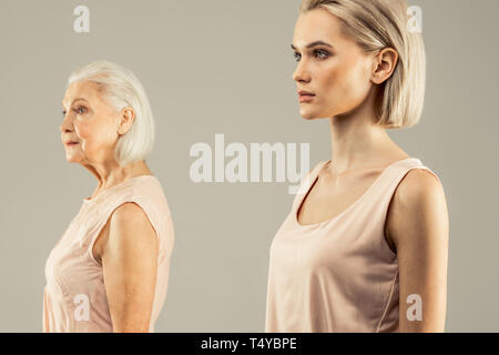 Beautiful blonde woman looking in front of her Stock Photo
