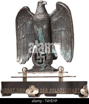 Professor Kurt Schmid-Ehmen (1901 - 1968) - a silvered bronze eagle in the shape of the eagle at the Luitpold Arena on the Nazi party rally grounds in Nuremberg. Bronze, silvered, monogrammed laterally 'K.S.E.'. The multi-piece, silvered resp. ebonised base with the presentation inscription 'Gewidmet von der Belegschaft' (Bestowed by the staff). Detailed miniature sculpture. Height 26 cm, total height 35 cm. The silvering probably later or renewed. Modelled on the seven-metre tall original at the Nazi party rally grounds. Prof. Kurt Schmid-Ehmen, the 'eagle maker', is consi, Editorial-Use-Only Stock Photo
