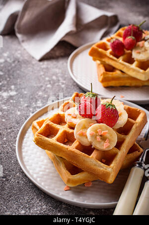 Waffles with strawberries and banana Stock Photo