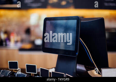 POS billing machine for payment with empty screen at coffee shop Stock Photo