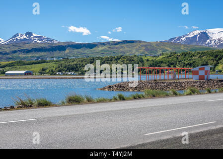 Runway of airport in Akureyri city over Pollurinn bay of Eyjafjordur fjord in Northern Iceland Stock Photo