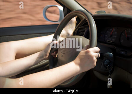 Long driving with leg up on dashboard during vacation. Stock Photo