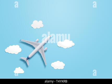 Small airplane model on the blue background with copy space