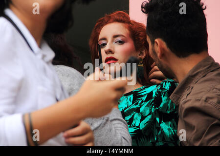 Merida, Venezuela - July 6, 2017: Unknown female model getting ready with the help of make up artists in the outdoors of local auditorium. Stock Photo