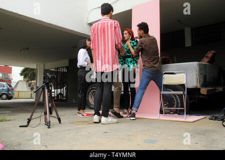 Merida, Venezuela - July 6, 2017: Unknown female model getting ready with the help of make up artists in the outdoors of local auditorium. Stock Photo