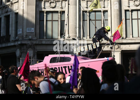 Police take control of Extinction Rebellion's 'Tell the Truth' boat, as protests continue at Oxford Circus in London. Stock Photo