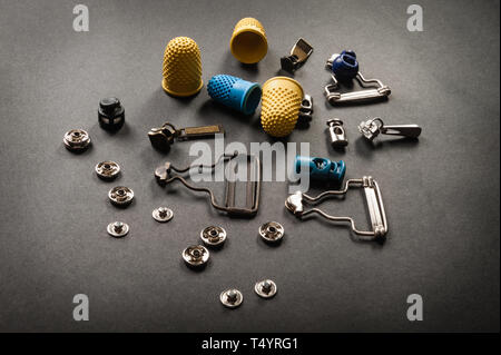 thimble and sewing pins on dark backdround Stock Photo