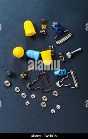 thimble and sewing pins on dark backdround Stock Photo