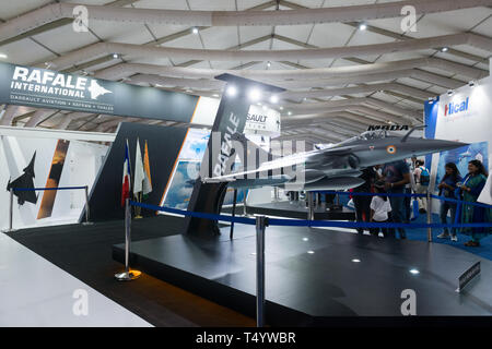 Bengaluru, India - February 22, 2019: Visitors at the Dassault Rafale stall at the Aero India 2019 exhibition in Bangalore, India. Aero India is a bie Stock Photo