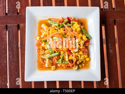 Corn seeds with fruits and vegetables sour spicy in white plate Stock Photo