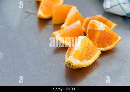 Ripe oranges slices on stainless table Stock Photo
