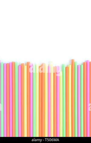 colored plastic drinking straws on a white background Stock Photo