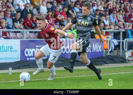Northampton, UK. 19th Apr 2019. Northampton Town's Sam Hoskins is fouled by Macclesfield Town's David Fitzpatrick during the first half of the Sky Bet League 2 match between Northampton Town and Macclesfield Town at the PTS Academy Stadium, Northampton on Friday 19th April 2019.   No use in betting, games or a single club/league/player publications. Credit: MI News & Sport /Alamy Live News Stock Photo