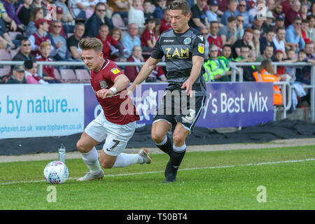 Northampton, UK. 19th Apr 2019. Northampton Town's Sam Hoskins is fouled by Macclesfield Town's David Fitzpatrick during the first half of the Sky Bet League 2 match between Northampton Town and Macclesfield Town at the PTS Academy Stadium, Northampton on Friday 19th April 2019.   No use in betting, games or a single club/league/player publications. Credit: MI News & Sport /Alamy Live News Stock Photo