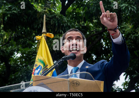 Caracas, Venezuela. 19th Apr, 2019. Juan Guaido, self-proclaimed interim president of Venezuela, speaks at an outdoor rally in the Plaza Bolivar. The opposition announces a new strategy against the government of Venezuelan President Maduro. Credit: Ruben Sevilla Brand/dpa/Alamy Live News Stock Photo