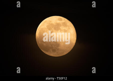 Merthyr Tydfil, South Wales, UK.  19 April 2019.  The Pink Moon phenomenon illuminates the skies over South Wales tonight, with a clear view treating stargazers worldwide.  Credit: Andrew Bartlett/Alamy Live News Stock Photo