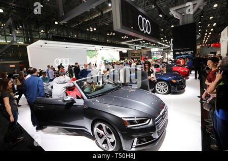 New York, USA. 19th Apr, 2019. Visitors look at Audi cars at the 2019 New York International Auto Show in New York, the United States, April 19, 2019. The 10-day, 2019 New York International Auto Show opened to public on Friday, introducing new automotive ideas, technological innovation, exceptional concept cars and nearly 1,000 of the latest new cars and trucks. Credit: Wang Ying/Xinhua/Alamy Live News Stock Photo