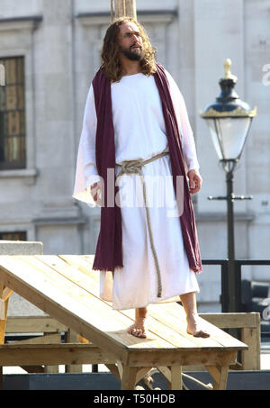 London, UK. 19th Apr, 2019. Jesus Christ during a performance of 'The Passion of Jesus' by Wintershall players in Trafalgar Square.Around 20,000 people packed London's Trafalgar Square for the annual performance of the Passion of Jesus by the Winterhall Players. The re-enactment of the life of Jesus from his arrival in Jerusalem to his crucifixion and eventual resurrection is performed by a cast over 100 actors and volunteers for free every Good Friday. Credit: Keith Mayhew/SOPA Images/ZUMA Wire/Alamy Live News Stock Photo