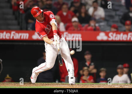 Anaheim, California, USA. 19th Apr 2019. Los Angeles Angels center fielder Mike Trout (27) hits a two run homer to tie the game in the 8th inning during the game between the Seattle Mariners and the Los Angeles Angels of Anaheim at Angel Stadium in Anaheim, CA, (Photo by Peter Joneleit, Cal Sport Media) Credit: Cal Sport Media/Alamy Live News Stock Photo