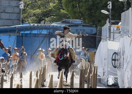 Tokyo, Japan. 20th Apr, 2019. A rider wearing traditional Japanese costume participates in a horseback archery ''Yabusame'' event at Sumida Park in Asakusa. The annual event is held in Sumida park by horseback archers aiming arrows at a target from a galloping horse. Credit: Rodrigo Reyes Marin/ZUMA Wire/Alamy Live News Stock Photo