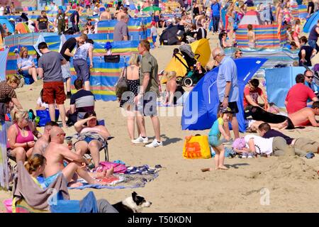 Weymouth, Dorset, UK. 20th Apr, 2109. Visitors to Weymouth beach enjoy the sunshine on what is expected to be the hottest day of the Bank Holiday weekend. Credit: Tom Corban/Alamy Live News Stock Photo