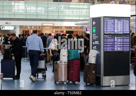 Tokyo, Japan. 19th Apr, 2019. The international terminal of Tokyo's Haneda airport is crowded with tourists to travel abroad on Friday, April 19, 2019. Japan will have ten-day Golden Week holidays from April 27 through May 6 since Emperor Akihito will abdicate on April 30 and Crown Prince Naruhito will ascend the throne on May 1. Credit: Yoshio Tsunoda/AFLO/Alamy Live News Stock Photo