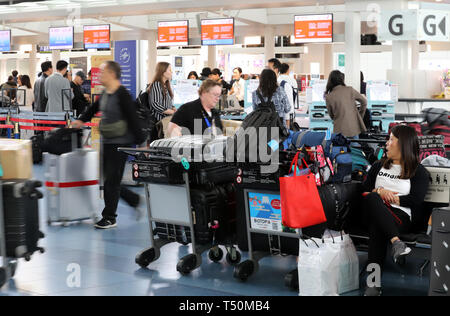 Tokyo, Japan. 19th Apr, 2019. The international terminal of Tokyo's Haneda airport is crowded with tourists to travel abroad on Friday, April 19, 2019. Japan will have ten-day Golden Week holidays from April 27 through May 6 since Emperor Akihito will abdicate on April 30 and Crown Prince Naruhito will ascend the throne on May 1. Credit: Yoshio Tsunoda/AFLO/Alamy Live News Stock Photo