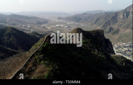 (190420) -- TIANJIN, April 20, 2019 (Xinhua) -- Aerial photo taken on April 19, 2019 shows the Huangyaguan Great Wall in the northern suburb of Tianjin, north China. The Huangyaguan Great Wall was built more than 14 centuries ago for border defense purpose. The structure winds its way for about 3,000 meters along the mountain areas of today's Jizhou District on the outskirts of Tianjin. (Xinhua/Yue Yuewei) Stock Photo