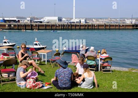Weymouth, Dorset, UK. 20th Apr, 2019. As the Bank Holiday temperature increases visitors make for Weymouth Old Town and harbour. Credit: Tom Corban/Alamy Live News Stock Photo