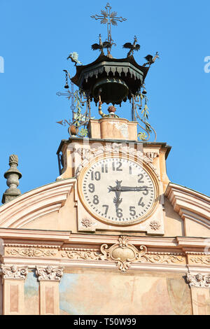 MONDOVI, ITALY - AUGUST 15, 2016: Saint Peter and Paul church clock and bell tower with automaton in a sunny summer day, blue sky in Mondovi, Italy. Stock Photo