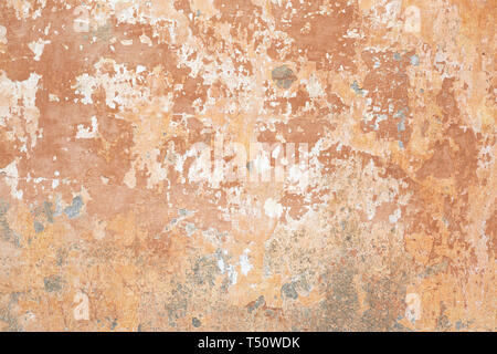Old beige chipped wall texture background in Italy Stock Photo