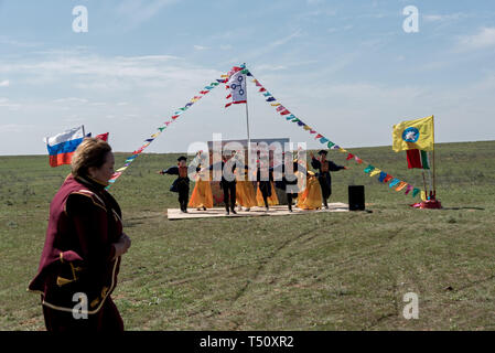 Kalmyk meeting ceremony and Kalmyk national ethnic dance in the steppe, Kalmykia, Russia Stock Photo