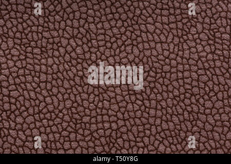 Simple relief brown fabric texture .Can be used as background. Stock Photo