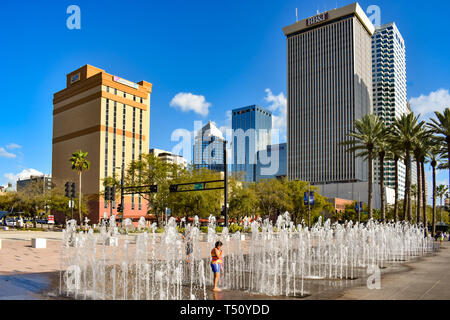 Tampa Bay, Florida. March 02, 2019 Children enjoying jets of water in downtown area  (1) Stock Photo
