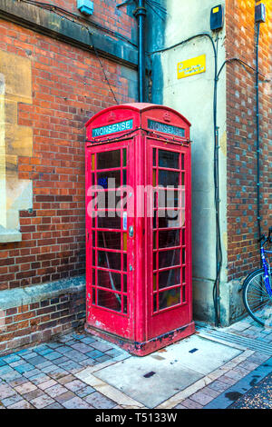 Red Grade II listed telephone box on Pembroke Street with the word Nonsense inscribed, Oxford, UK Stock Photo