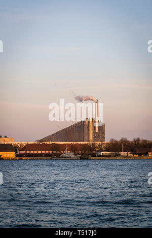 View of Amager Bakke or Amager Hill also known as Amager Slope or Copenhill, a combined heat and power waste-to-energy plant in Amager, Copenhagen, De Stock Photo