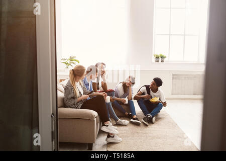 Happy students spending time together and talking Stock Photo
