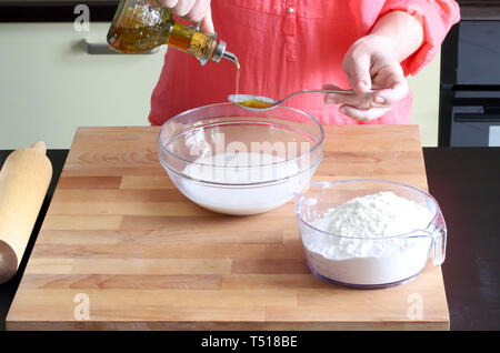 hands woman preparing yeast dough Stock Photo