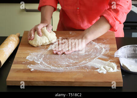 hands woman preparing yeast dough Stock Photo