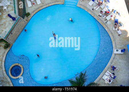 Cartagena Colombia,El Lagito,Hotel Dann,hotel,pool,amenity,Hispanic resident,residents,guests,man men male,swimming,lounging,aerial overhead view,COL1
