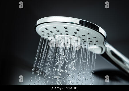 Close-up Of Water Flowing From Shower In The Bathroom Stock Photo