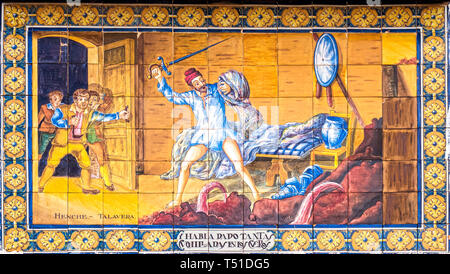 Escena de Don Quijote de la Mancha (rompiendo con la espada los cueros de vino) en cerámica. La Venta de Don Quijote. El Toboso. Toledo. Castilla la M Stock Photo