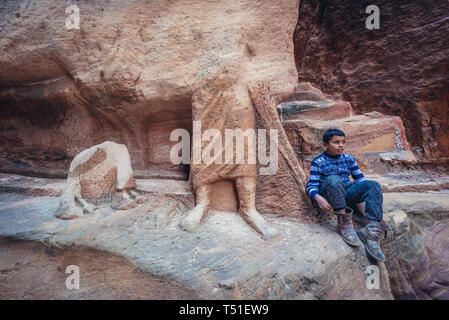 Sculptures in Siq canyon in Petra historical city of Nabatean Kingdom in Jordan Stock Photo