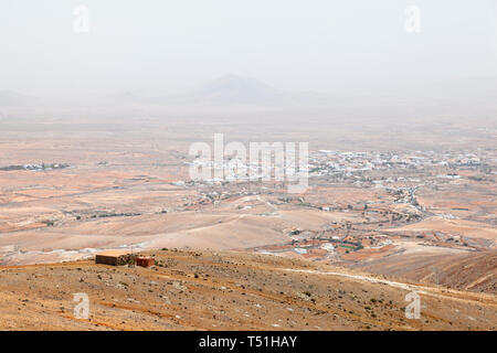 View from the Mirador Morro Velosa during a Sahara sandstorm to Antigua, Fuerteventura. Stock Photo