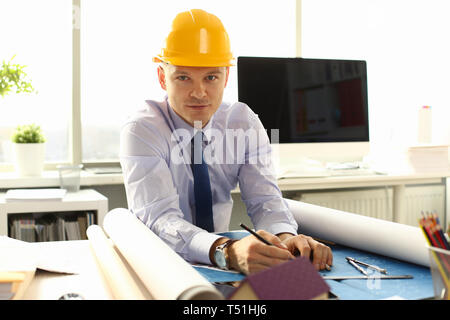 Young Architect Freelance Man Working on Blueprint Stock Photo