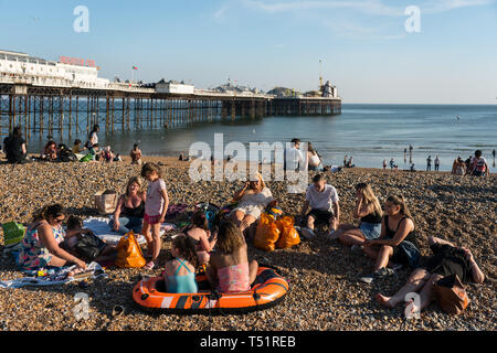 People enjoying the unusually warm spring weather on Brighton beach on Good Friday at the start of the Easter weekend. Photo date: Friday, April 19, 2 Stock Photo