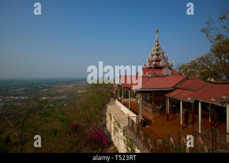 At the top of Mandalay Hill, the Su Taung Pyae Pagoda has a beautiful view of the city and beyond. In Myanmar. Stock Photo